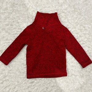 Red sweater with higher neckline and button closure